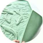 Flexible fish-relief mat showing the patterned face and reverse